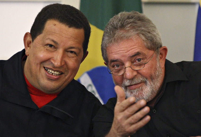 Brazil's President Lula and Venezuela's President Chavez smile during a ceremony in Salvador City